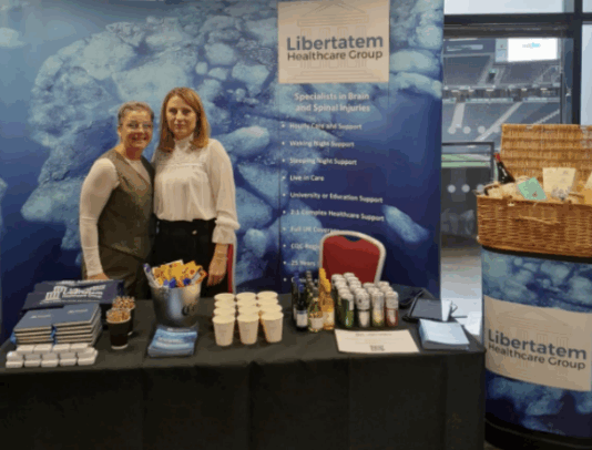 SIA Headway Conference attendees at promotion stand